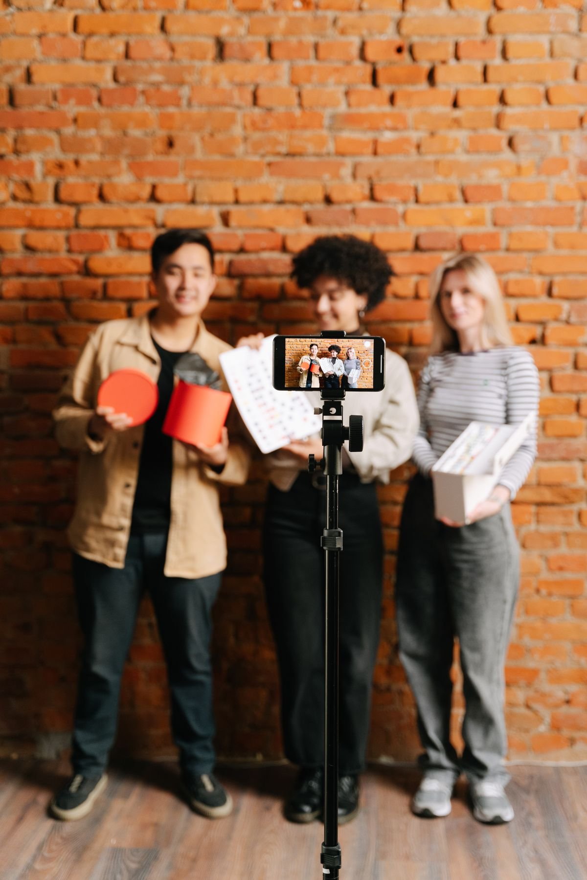 Editing faceless Instagram reels on a phone with on-screen text for a local business